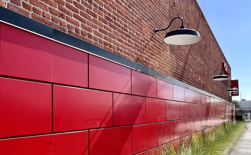 Modern retail exterior with warm materials and guest seating, illustrating design and customer experience integration